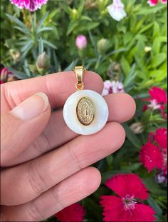 This delicate pearl shell is one of a kind. It holds a handcrafted medal made from gold-filled stainless steel, which has been carefully polished to shine beautifully, and features a lovely relief of the Virgin of Guadalupe. It comes with a gorgeous 15 inch gold-filled stainless steel chain to wear it close to your heart. The Virgin of Guadalupe is a symbol of love, purity, and sacrifice to the people of Mexico. For centuries she has been a beacon in the darkness to help those in need. She is a Crystal Bath, Virgin Of Guadalupe, Candle Carving, Iridescent Pearl, Crystal Angels, Crystal Tree, Crystal Wand, Pearl Shell, Shell Necklaces