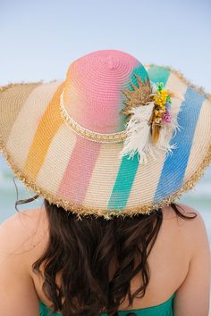 Bask in the sun with our Tropical Sunshine Sun Hat! The playful rainbow stripes add a pop of color while the cream and gold band adds a touch of elegance. Featuring white and gold feathers, bright flowers, and a gold sequin sun patch, this hat is perfect for adding some fun to your summer outfit. This hat is ONE OF A KIND, created by our owner Stephanie. To receive item quicker, expedited shipping is available at checkout. Gold Feathers, Bright Flowers, The Cream, Gold Sequin, Cream And Gold, Rainbow Stripes, Sun Hat, Gold Band, Summer Outfit