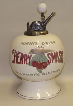 an old fashioned cherry smasher is on display