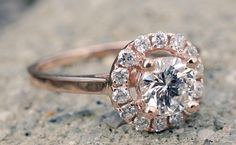 a close up of a diamond ring on the ground