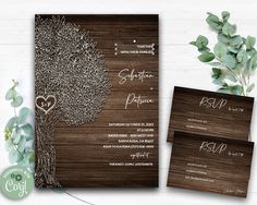 wedding stationery with tree and heart on wood grained paper, greenery in the background