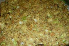 a casserole dish with meat and vegetables in it on a white plate, ready to be eaten