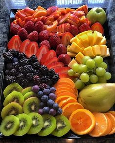 a tray filled with lots of different types of fruit