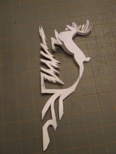 a piece of paper cut out to look like a deer