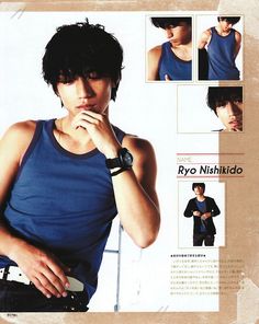 a young man wearing a blue tank top