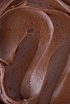 a close up of a chocolate frosted cake