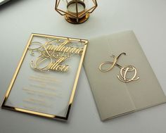 wedding stationery items displayed on table next to lamp