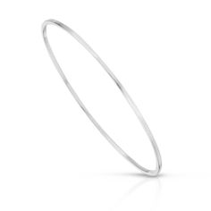 Skinny Stella Bangle is made out of square shaped brass wire but holds a circular shape.Bangle measures 1/16" thick with a diameter of 2.625"Finishes Available: 14K Yellow Gold Rhodium (Silver)