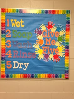 a bulletin board with handprints on it that says, give me five dry