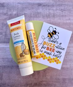 two tubes of sunscreen and a note on a plate next to a bee lotion