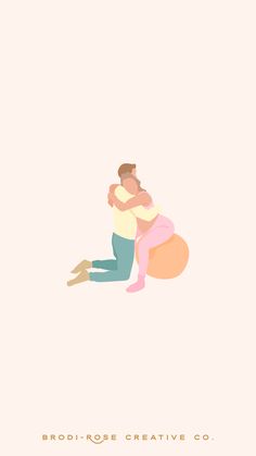 two people hugging each other while sitting on the ground