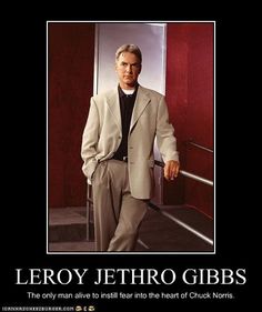 a man in a suit and tie standing next to a red wall with the caption leroy jethro gibs