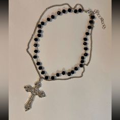 Beautiful Statement Piece, Gothic Cross Pendant On A Double Layered Black Beaded Choker Necklace. *Beaded Chain Length: 35cm + 5cm Extension Chain. *Silver Tone Chain Length: 40cm+5cm Extension Chain. *Cross Size: 5.5cm X 3.7cm *Material: Zinc Alloy. *Brand New. * Ready To Ship Next Day * If You Are Interested In More Than One Item From My Store Pleased Message Me To Make A Bundle For You With Combined Shipping. #Bigcross #Crystaljewelry #Rosarynecklace #Crossnecklace #Grungenecklace Tags: Gothi Black Metal Beaded Necklace With Silver Beads, Black Beaded Necklace With Silver Beads, Black Beaded Cross Necklace, Gothic Silver Beaded Necklaces With Black Beads, Grunge Beaded Necklace, Grunge Necklace, Layered Beaded Necklaces, Gothic Cross, Gothic Crosses