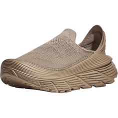 The HOKA Restore TC is a sporty unisex slip-on shoe that is designed for maximum comfort and uses earth-friendly sugarcane based materials. These HOKA Restore TC Dune/Oxford Tan Mesh Unisex Shoes have the following features: Engineered Jacquard Mesh Soft and stretchy seam-free sock-like upper for non-invasive comfort Dope Dye Yarn Process Extended Heel Pull Gusseted Tongue Moulded Sockliner with 30% Sugarcane EVA The 30% sugarcane-based EVA insole and 20% sugarcane-based EVA outsole provide a pl Dye Yarn, Athleisure Sneakers, Clog Slippers, Free Socks, Birkenstock Sandals, Flip Flop Shoes, Trail Shoes, Unisex Shoes, Jacquard Knit