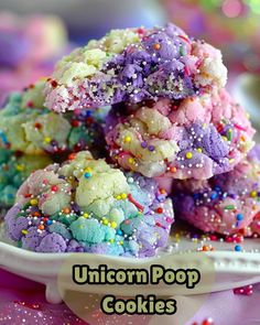 unicorn poop cookies on a plate with sprinkles in the background and text overlay that reads, unicorn poop cookies