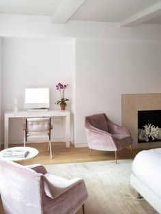 a living room filled with furniture and a fire place