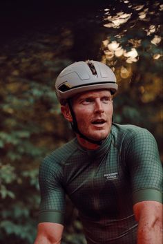 a man wearing a helmet while riding a bike