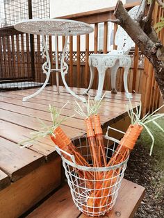 some carrots are in a basket on the porch