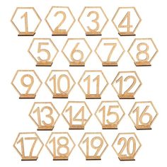 wooden numbers are arranged in the shape of hexagonals on a white background