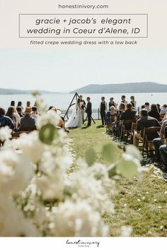 an outdoor wedding ceremony with flowers in the foreground