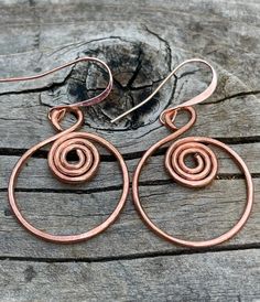 Large wire wrapped solid copper Boho earrings. The solid copper earrings have a beautiful spiral pattern. They are bright and also lightweight. Statement earrings without weighing you down. These earrings are 1 and 3/4 of an inch long and one inch wide. The earwires are solid copper. All my jewelry comes gift boxed with a custom Shelly Mariposa Design butterfly card ready for gift giving, whether it is a gift for you or someone special. Your satisfaction is very important to me. I make every eff Wire Wrapped Spiral Copper Earrings, Wire Wrapped Copper Spiral Earrings, Copper Spiral Wire Wrapped Earrings, Rose Gold Wire Wrapped Copper Wire Earrings, Rose Gold Wire Wrapped Earrings In Copper, Rose Gold Wire Wrapped Earrings, Handmade Spiral Copper Wire Earrings, Bohemian Spiral Copper Wire Earrings, Hand Forged Copper Spiral Earrings