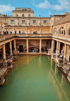 a large pool in the middle of an old building