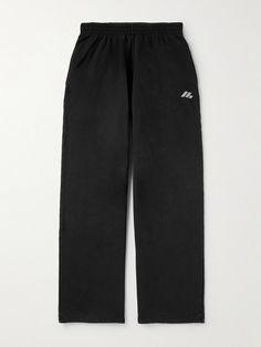 Balenciaga's sweatpants are printed with a logo that's inspired by retro racing styles. They're cut for a baggy, wide-leg fit from soft cotton-jersey and have a comfortable elasticated waistband. Balenciaga Sweatpants, Black Baggy Sweatpants, Singer Dr, Balenciaga Clothing, Sweatpants For Men, Balenciaga Men, Lee Juyeon, Baggy Sweatpants, Closet Organizer