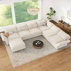 a living room with a large white sectional couch