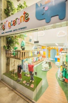 children's clothing store front with glass display