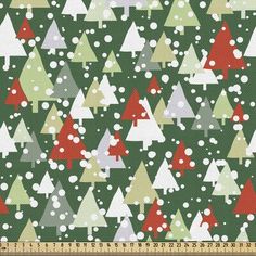 a green and red christmas tree pattern with white dots on the bottom, surrounded by snowflakes