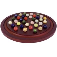 a game board with lots of different colored balls on it's surface and in the middle