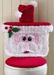 a knitted santa hat on top of a toilet