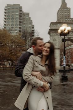 Nyc photoshoot photographer New York City Manhattan Brooklyn editorial nontraditional unique cute artsy creative timeless warm tone and colors moody muted couple photoshoot photos engagement couple Washington square park rainy day shoot rain couple outfit ideas neutrals tan trench coat blurry astetic photos motion Washington Square Park Engagement Photos, Boston Engagement Photos Winter, Nyc Christmas Engagement Photos, Washington Square Park Photoshoot, Town Square Photoshoot, Rainy City Photoshoot, West Village Nyc Engagement Photos, Lehengas Photoshoot, Classy Winter Engagement Photos