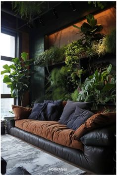 a living room filled with lots of plants on the wall next to a couch and coffee table