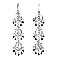 With elegant intricate openwork motifs this pair of dangle earrings is handcrafted from sterling silver. Indonesia's Made Sugi designs the earrings adding petite stones of black onyx to dangle from them. Black Elegant Chandelier Earrings, Nickel Free, Black Filigree Dangle Jewelry, Sterling Silver Filigree Dangle Chandelier Earrings, Sterling Silver Filigree Chandelier Earrings, Black Sterling Silver Chandelier Dangle Earrings, Black Sterling Silver Dangle Chandelier Earrings, Black Filigree Earrings, Traditional Black Sterling Silver Earrings, Elegant Black Filigree Earrings