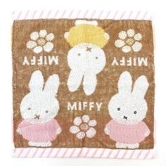 a brown and white towel with rabbits on it