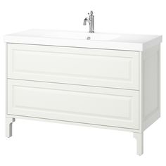 a white bathroom vanity with two drawers and a faucet on one side,