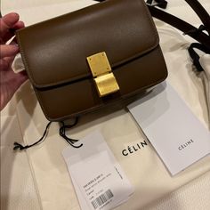 This Is An Authentic Celine Box Calfskin Small Classic Box Bag In Caramel. This Stylish Shoulder Bag Is Crafted Of Fine Smooth Leather In Brown. It Features A Long Leather Shoulder Strap And A Front Flap With A Matte Gold Press Lock That Opens To A Partitioned Leather Interior. Like New Condition, No Visible Scratches Or Scuffing. Comes With Authentic Paperwork, Tag And Dust Bag. Final Sale. Base Length: 6.50 In Height: 5.50 In Width: 2.75 In Drop: 16.25 In Celine Classic Box Bag, Celine Classic Box, Celine Box, Stylish Shoulder Bag, Celine Bags, Caramel Color, Box Bag, Matte Gold, Leather Interior