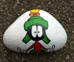 a rock with a cartoon character painted on it