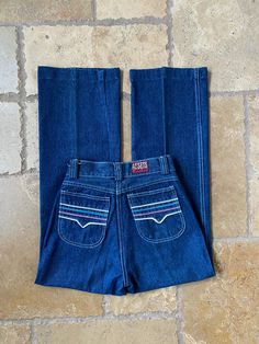 "1970s straight leg jeans by the brand Just Pants. Made out of 100% cotton and made in Hong Kong. High waisted with amazing embroidered back pockets. Hemmed bottoms which are perfect for petites! Measurements: W: 11\" taut: 11.75\" R: 11\" H: 16\" I: 26\" (hemmed) C: 8.25\"" 90s Style Cotton Flare Jeans With Pockets, 90s Cotton Flare Jeans, Retro Mid-rise Cotton Flare Jeans, Retro Wide-leg Bottoms With Patch Pockets, Retro Wide Leg Bottoms With Patch Pockets, Retro High Waist Cotton Flare Jeans, Retro Straight Leg Bottoms With Patch Pockets, Retro Style Denim Blue Cotton Pants, Retro Denim Blue Cotton Jeans