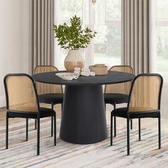 a round table with four chairs around it