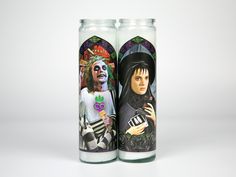 "Recently deceased? Read the handbook! Or call on Beetlegeuse. Are you strange and unusual? She herself, is, too. Plus up your decor with this Beetlejuice and Lydia prayer candle set. Digitally illustrated parody art prayer candles inspired by Beetlejuice and Lydia Deetz. Check out the shop for Lydia and Beetlejuice individually. Find even MORE saints on our website! Check out theeternalflamecandles.com and sign up for our mailing list to receive special offers and discounts! 8\" unscented candl Lydia And Beetlejuice, Compliment Cards, Strange And Unusual, Lydia Deetz, Art Parody, Candle Packaging, Curated Gift Boxes, Movie Lover