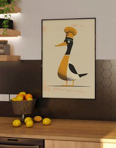 a kitchen with a bowl of oranges on the counter and a framed duck poster above it