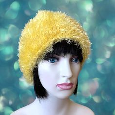 This light sunny yellow handmade knitted hat is crafted from soft plush yarn, offering both comfort and style during the winter months. The fluffy and soft texture keeps your head warm while highlighting your style. Lovingly handmade, this hat ensures all-day comfort with its flexible structure. If you're looking for a special gift for yourself or your loved ones, this yellow plush hat is a wonderful choice. Additionally, this hat is the perfect accessory to complete your style during winter holidays and Christmas. It is made of a high quality European yarn with 100% polyester. This hat a one size,will fit perfectly a small and medium adult heads but due to its stretchy nature might accomodate larger heads too. only one available in this color. Care Instructions: Hand wash with cold water Plush Hat, Plush Yarn, Sunny Yellow, Hat For Women, Winter Hats For Women, Color Care, Knitted Hat, Soft Yarn, Winter Months