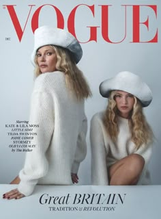 two women in white sweaters and hats on the cover of a magazine, one is sitting down