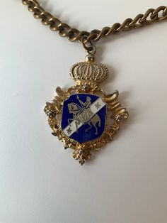 Stunning pendant. Coat of arms Coro. Signed. Dual insignia. The lower insignia, from a bit of research, would date this piece around 1944-1947 (differing sources). It is certainly pre 1955 when the circular copyright symbol was adopted. A high quality Coat of Arms pendant on a quality, hefty chain. The entire piece weighs 91 grams. In very good condition as shown in the photos. Vintage Pendant Brooches For Ceremonial Occasions, Vintage Ceremonial Pendant Brooches, Vintage Ceremonial Pendant Brooch, Antique Coat Of Arms Jewelry For Formal Occasions, Vintage Formal Coat Of Arms Jewelry, Vintage Medallion Brooch Jewelry, Vintage Hallmarked Pendant Brooches, Vintage Silver Jewelry With Coat Of Arms, Vintage Hallmarked Jewelry For Commemoration