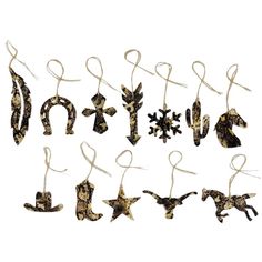 an assortment of christmas ornaments hanging from strings on a white background with snowflakes in the shape of animals