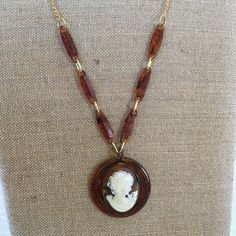 "Handmade Celluloid Cameo Gold Metal Necklace. Repurposed Old Broken Cameo Necklace With Celluloid Chain Additions. This Lovely Piece Can Continue to be Enjoyed as a Remade Piece. Brown Marbleized Celluloid Cameo PENDANT on Accented Chain. Extra O Rings Added to Adjust the Necklace Length. This Old Costume Jewelry Cameo Necklace is in good shape for its age. Size: 2\" Circle Celluloid With Oval 1 1/4\" X 1 5/8\" Cameo, 32\" Accented Chain For other handmade, jewelry and vintage items see: www.Ve Vintage Amber Resin Jewelry, Antique Brown Necklace For Collectors, Vintage Handmade Amber Necklace, Vintage Gold Resin Jewelry, Handmade Vintage Amber Necklace, Vintage Amber Necklaces For Jewelry Making, Handmade Retro Resin Jewelry, Vintage Brown Medallion Jewelry, Handmade Vintage Resin Jewelry