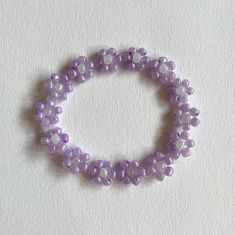 Purple flower bracelet. Made with elastic nylon thread. Flowers Handmade, Flower Bracelet, Purple Flower, Handmade Bracelet, Bracelet Jewelry, Purple Flowers, Handmade Bracelets, Sweden, Beauty Book