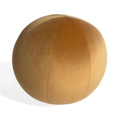 a large brown ball sitting on top of a white floor